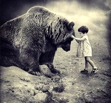 Child Touching Bear